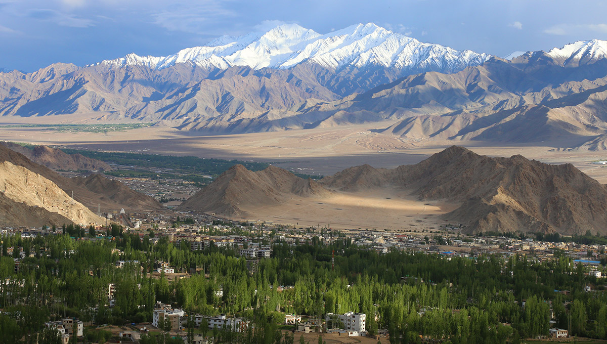 Leh City, the capital of Ladakh with Stok Kangri Mountain range seen from the Peace Pagoda.